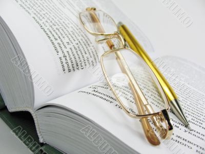 glasses & pen on book 1