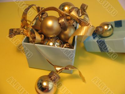 Blue gift box with golden balls