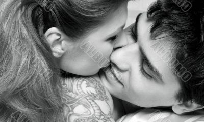 monochrome picture of sweet couple in bed