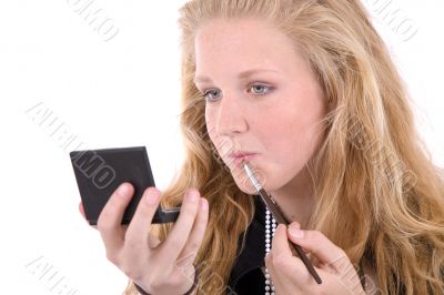 Checking her lipstick