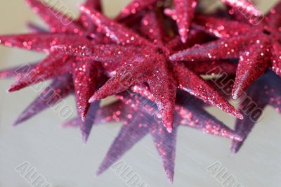 Red stars on shiny surface