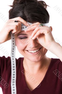 Pretty woman measuring her forehead