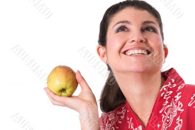 Pretty brunette holding an apple