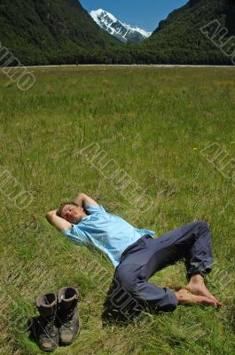Young man resting on the grass