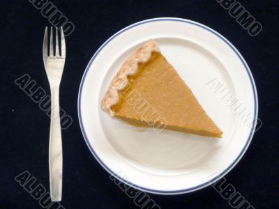 Pumpkin pie on plate