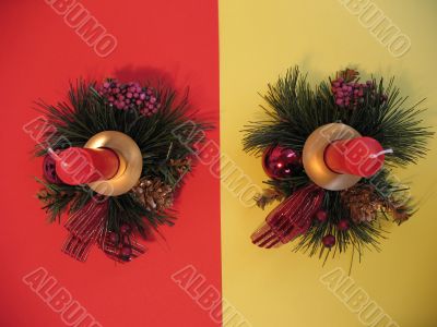 Two candles on red and yellow background