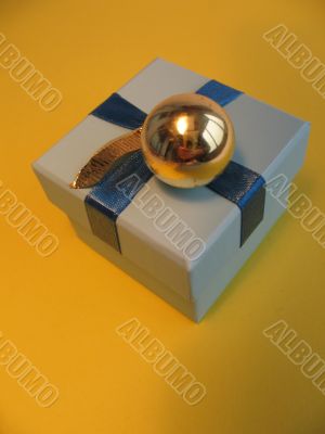 Christmas gift box and golden ball