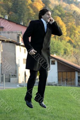 Happy jumping businessman
