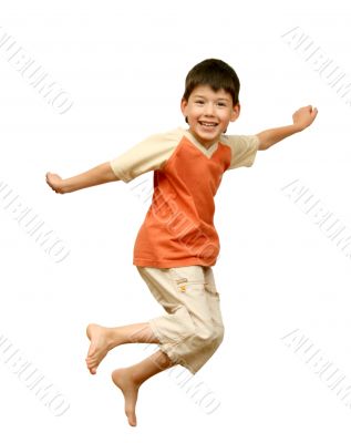 Boy jumps on white background.