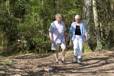 Senior couple strolling through the park