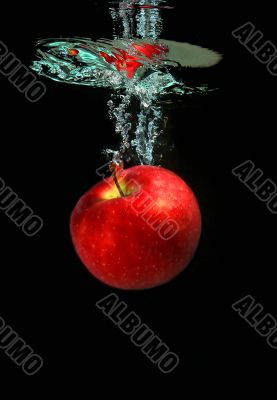 Apple falling into water