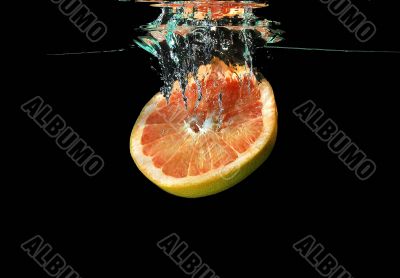 Grapefruit  falling into water