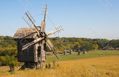 Old wooden windmill in autumn