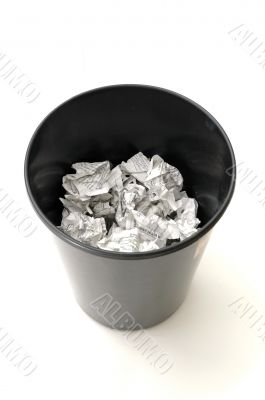 Bin half filled with paper