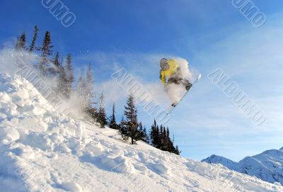Flying yellow snowboarder