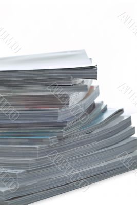 Stack of magazines on white