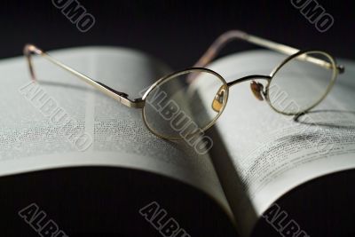 Book and reading glasses