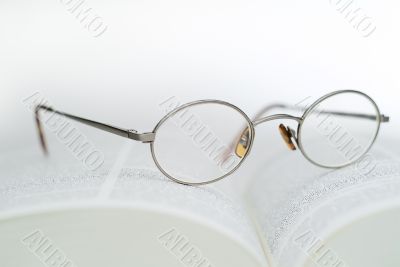 Book and reading glasses