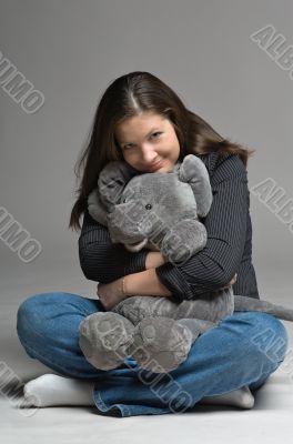 young woman with big toy mouse