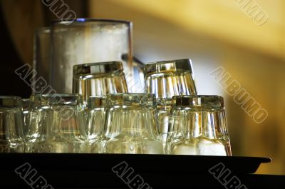 Stack of clean glassware waiting in a cafe