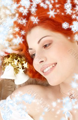 redhead girl with christmas bells and snowflakes