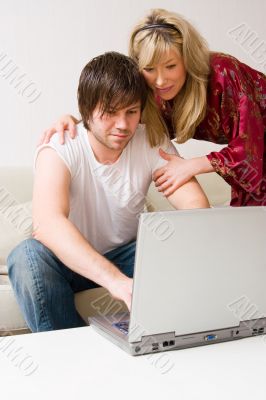 couple using laptop