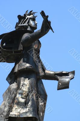sculpture with a feather and the book