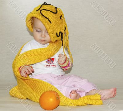  little girl, yellow cap and scarf