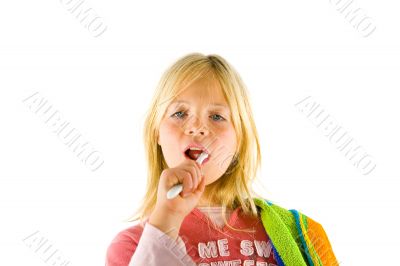 Little girl brushes her teeth