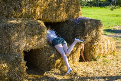 Cute girl on haybales