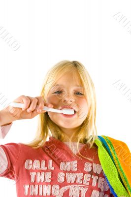 Little girl brushes her teeth