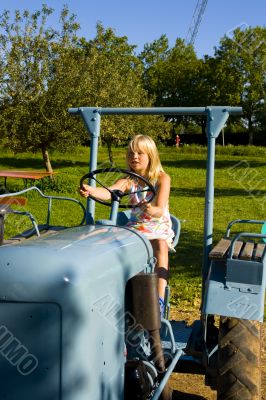Farmer`s daughter on a tractor