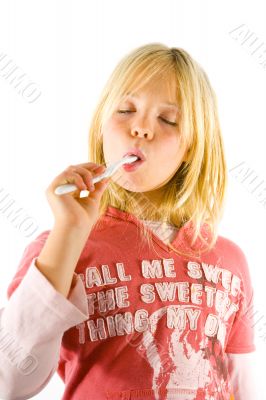 Little girl brushes her teeth