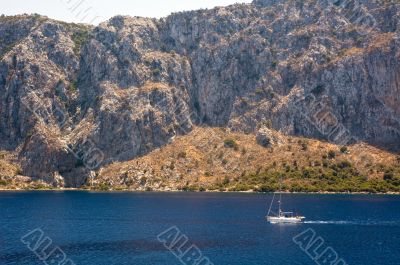 Yacht in front of a mountain