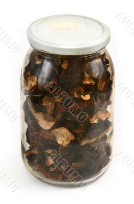 glass jar full of dried mushrooms