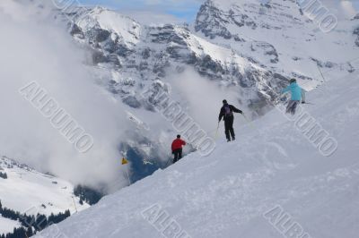 Three skiers traversing