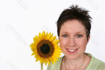 Woman`s face and a sunflower