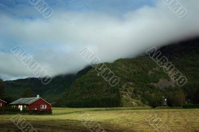 Rural norway andscape with mountain and houses
