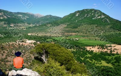 man standing on a rock