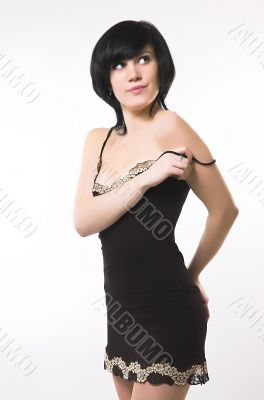 Seductively looking brunette on a white background