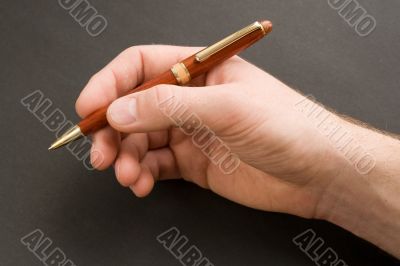 Hand with a pen