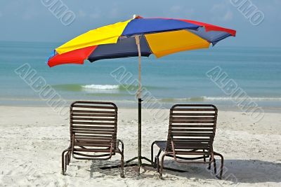 colorful umbrella on empty beach
