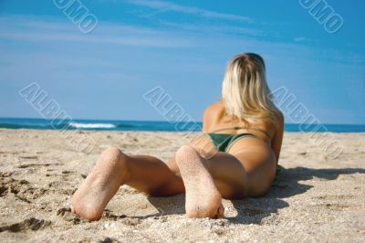 young girl on beach, focus on her feet