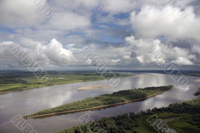 Clouds over big river.