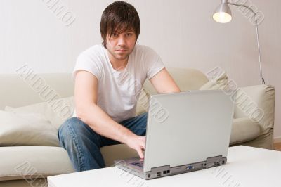 young man working on laptop computer