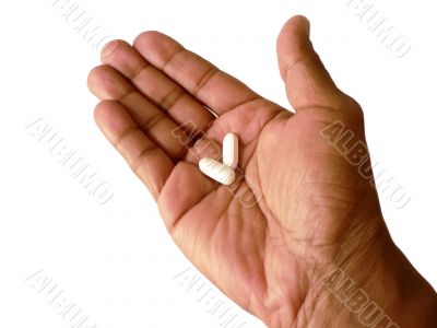 aspirin in open hand