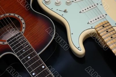Closeup of 2 guitars