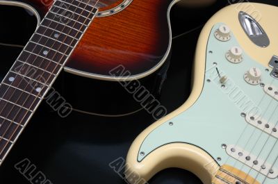 Closeup of 2 guitars