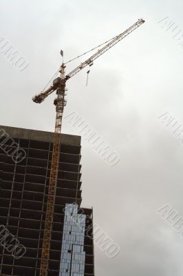 Construction of a tall modern office building.