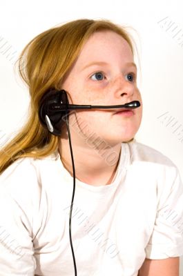 little girl listening on headset